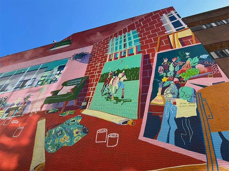 A colourful mural on the brick wall beside Togetherheads Studio in Mount Pleasant